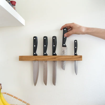 Store kitchen knives in a wall mounted knife rack
